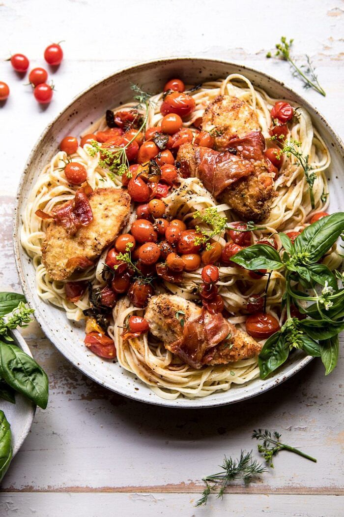 Prosciutto Chicken Parmesan with Garlic Butter Tomato Pasta | halfbakedharvest.com #pasta #easyrecipe #tomatoes #familyrecipes overhead photo of Prosciutto Chicken Parmesan with Garlic Butter Tomato Pasta