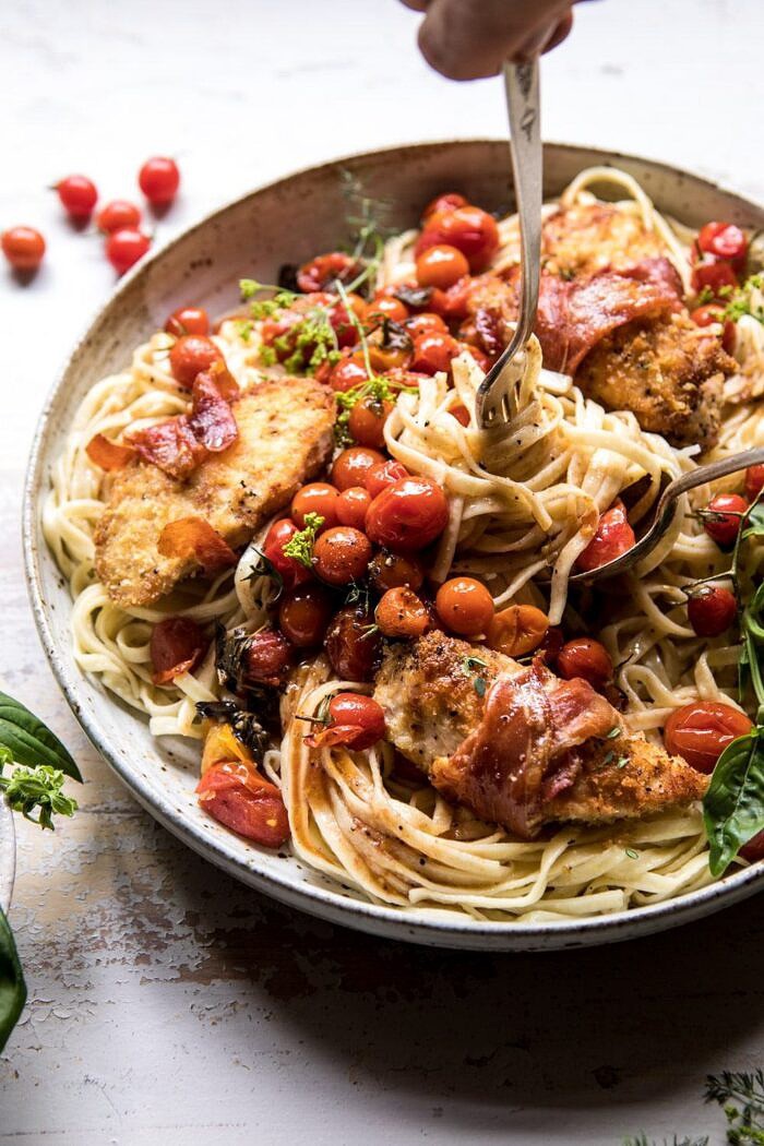 Prosciutto Chicken Parmesan with Garlic Butter Tomato Pasta | halfbakedharvest.com #pasta #easyrecipe #tomatoes #familyrecipes side angle photo of Prosciutto Chicken Parmesan with Garlic Butter Tomato Pasta