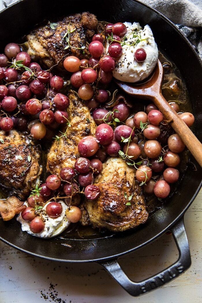 Thyme Roasted Chicken with Grapes and Burrata | halfbakedharvest.com #roastedchicken #easyrecipes #fall #autumn #skilletrecipes overhead close up photo of Thyme Roasted Chicken with Grapes and Burrata