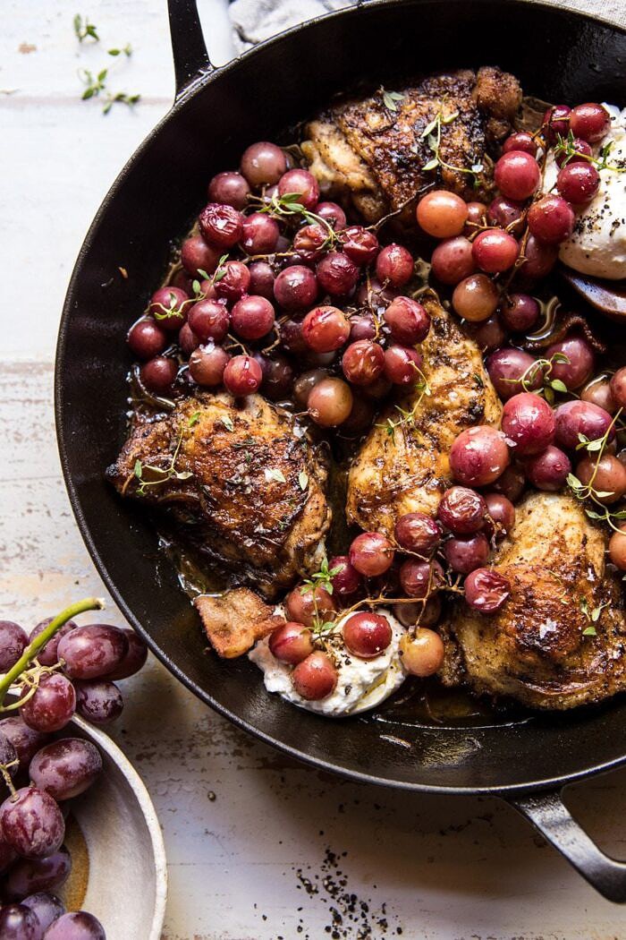 Thyme Roasted Chicken with Grapes and Burrata | halfbakedharvest.com #roastedchicken #easyrecipes #fall #autumn #skilletrecipes side angled photo of Thyme Roasted Chicken with Grapes and Burrata