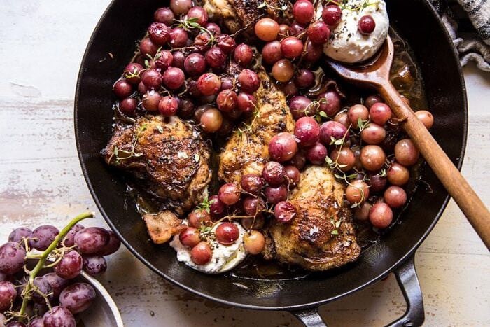 Thyme Roasted Chicken with Grapes and Burrata | halfbakedharvest.com #roastedchicken #easyrecipes #fall #autumn #skilletrecipes horizontal photo of Thyme Roasted Chicken with Grapes and Burrata