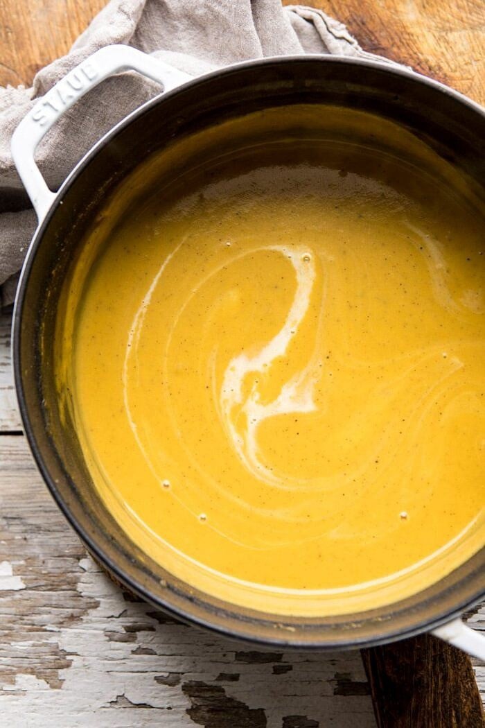 overhead photo of Cheddar Apple Butternut Squash Soup in soup pot