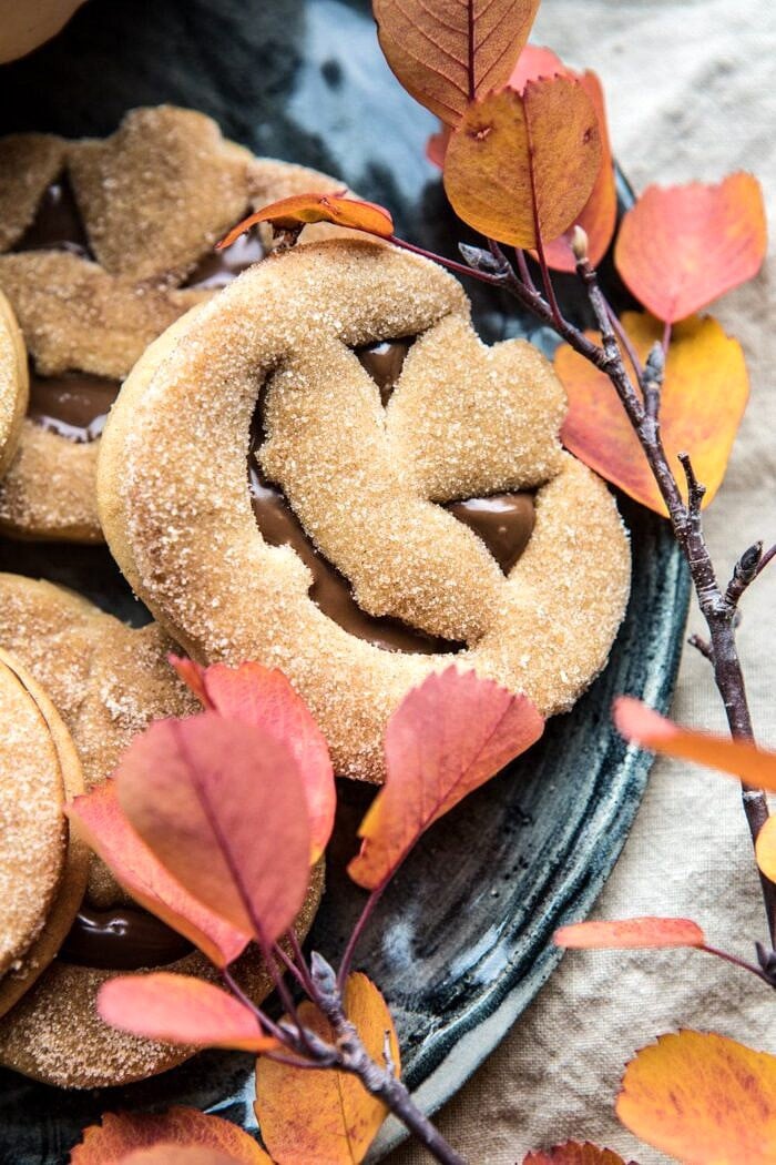 close up photo of Milk Chocolate Stuffed Jack-O'-Lantern Cookies on plate