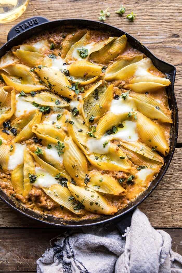 Spicy Pumpkin and Pesto Cheese Stuffed Shells | halfbakedharvest.com #pumpkin #pasta #Italian #easy #dinner #fall #fallrecipes overhead photo of Spicy Pumpkin and Pesto Cheese Stuffed Shells