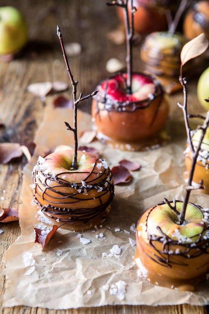 Sweet and Salty Chocolate Drizzled Cider Caramel Apples | halfbakedharvest.com #fallrecipes #apples #caramel #hallaween #thanksgiving close up photo of Sweet and Salty Chocolate Drizzled Cider Caramel Apples
