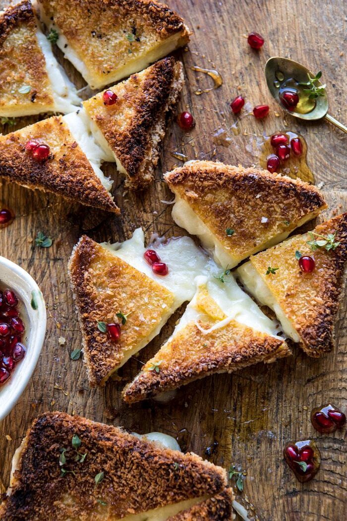 Fried Mozzarella Sandwiches with Pomegranate Honey | halfbakedharvest.com #grilledcheese #appetizer #easyrecipes #holidayrecipes #Christmas overhead photo of Fried Mozzarella Sandwiches with Pomegranate Honey cut into triangles