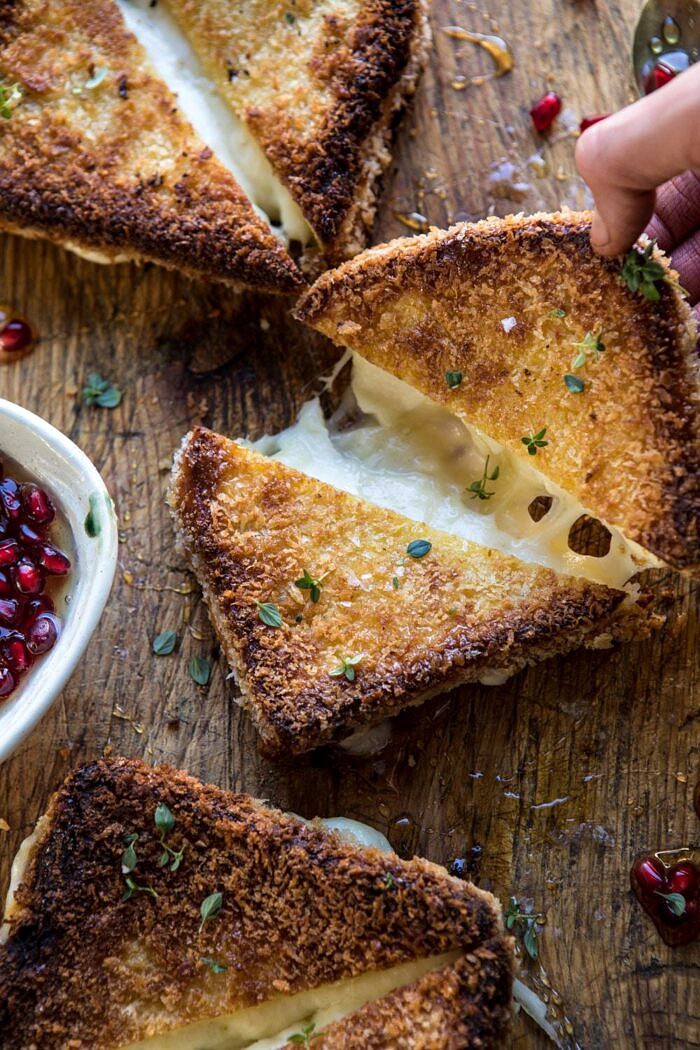 Fried Mozzarella Sandwiches with Pomegranate Honey | halfbakedharvest.com #grilledcheese #appetizer #easyrecipes #holidayrecipes #Christmas Fried Mozzarella Sandwiches with Pomegranate Honey being pulled apart
