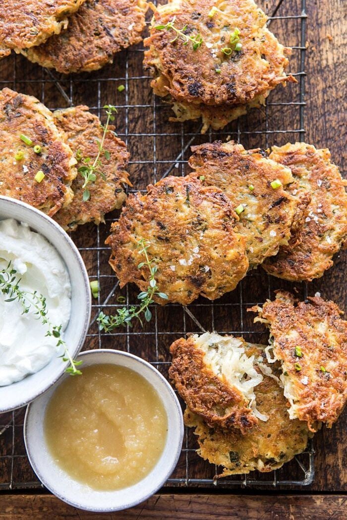 overhead photo of Herbed Cheddar Latkes with latke broken in half