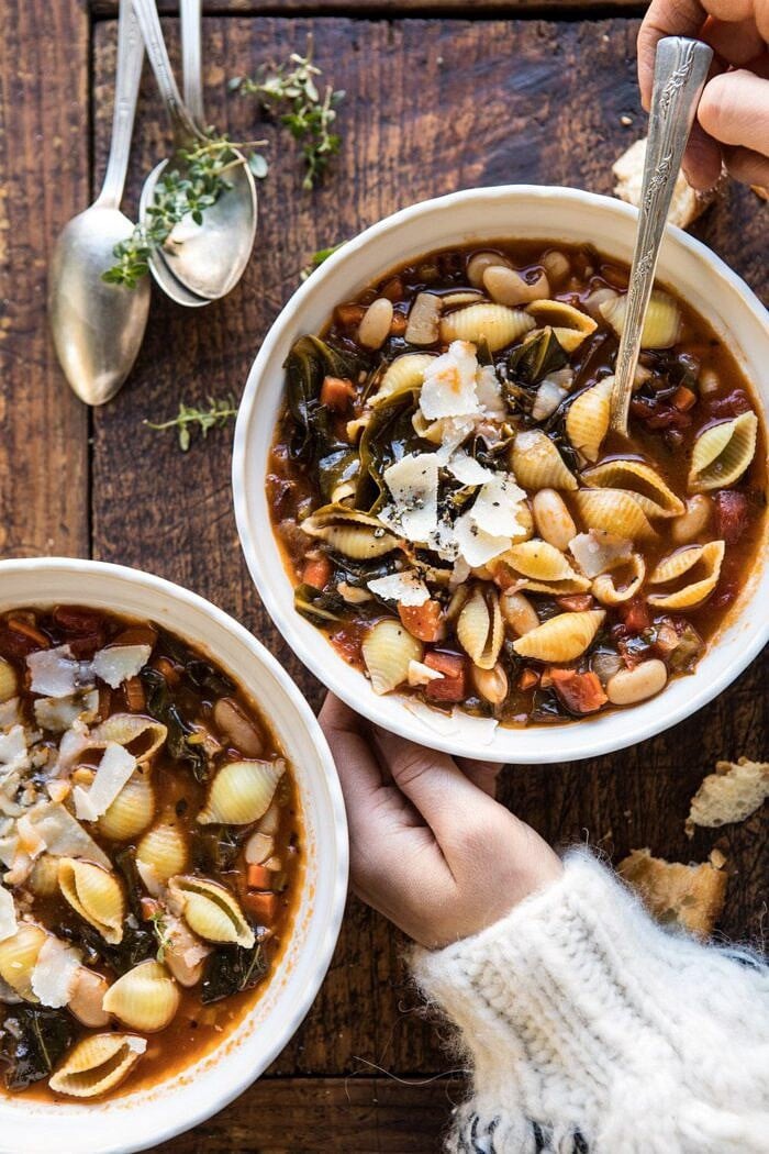 Instant Pot Pasta e Fagioli | halfbakedharvest.com #instantpot #soup #healthyrecipes overhead photo of Instant Pot Pasta e Fagioli with hands on bowl