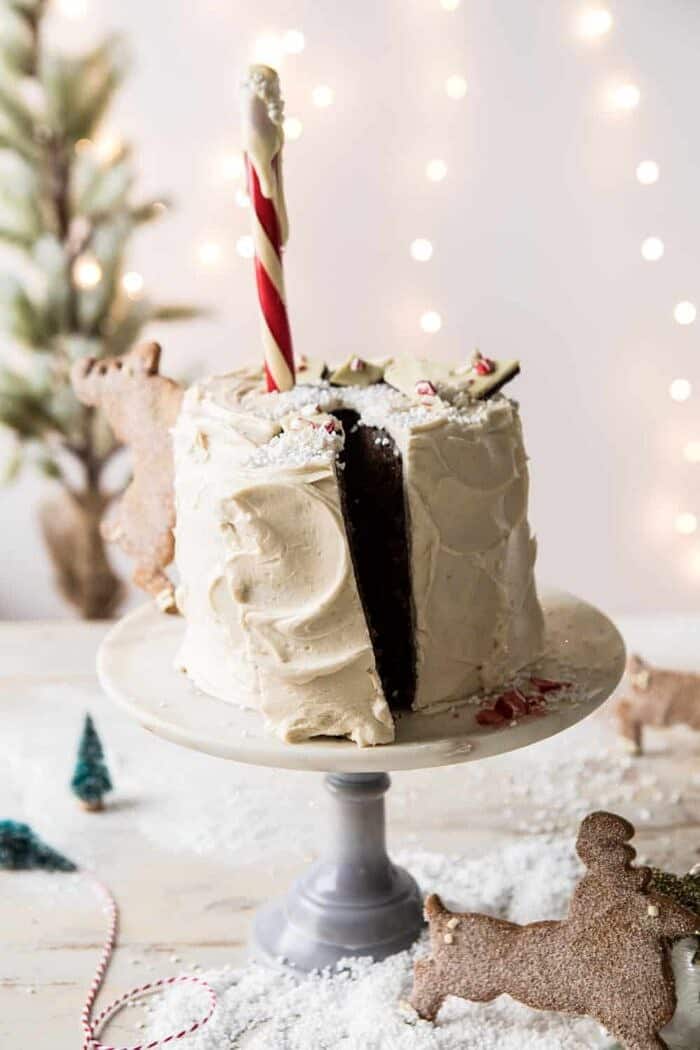 North Pole Cake | halfbakedharvest.com #chocolatecake #christmas #holiday #dessert front on photo of North Pole Cake with slice cut