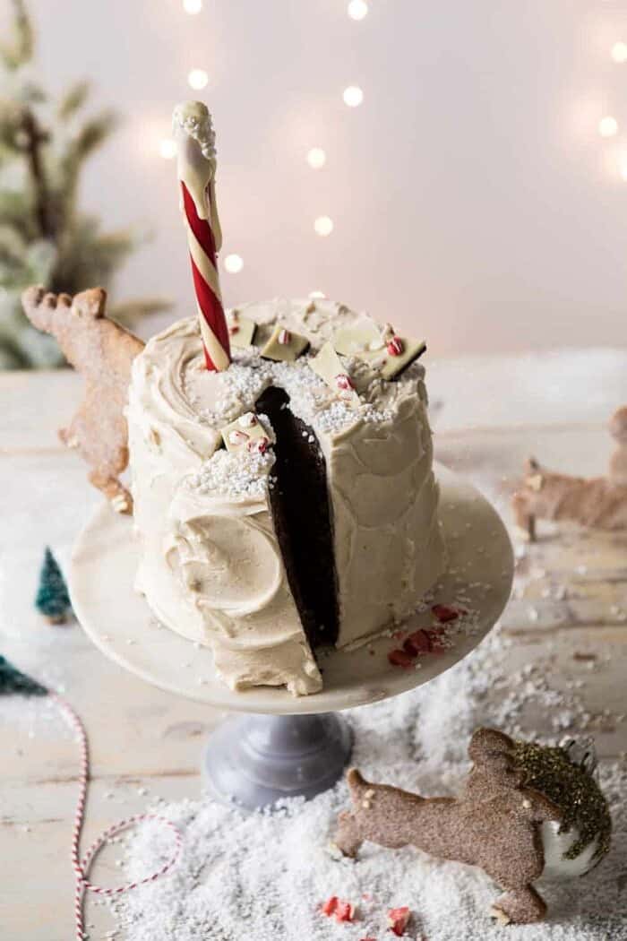 North Pole Cake | halfbakedharvest.com #chocolatecake #christmas #holiday #dessert angled North Pole Cake with slice cut
