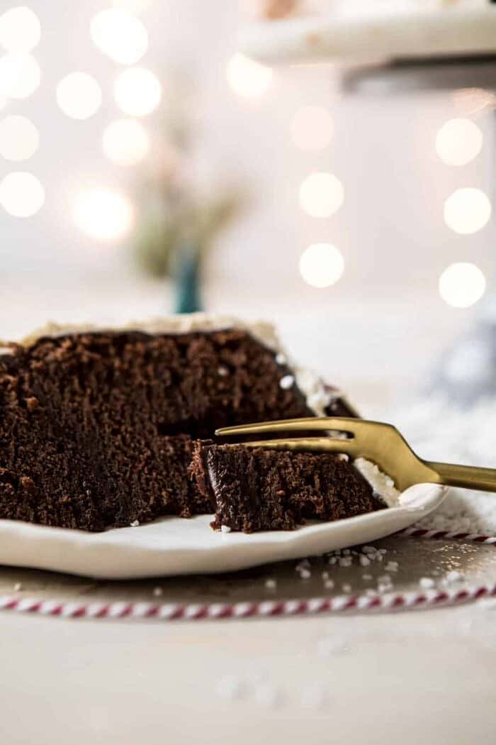 North Pole Cake | halfbakedharvest.com #chocolatecake #christmas #holiday #dessert North Pole Cake slice with fork on cake