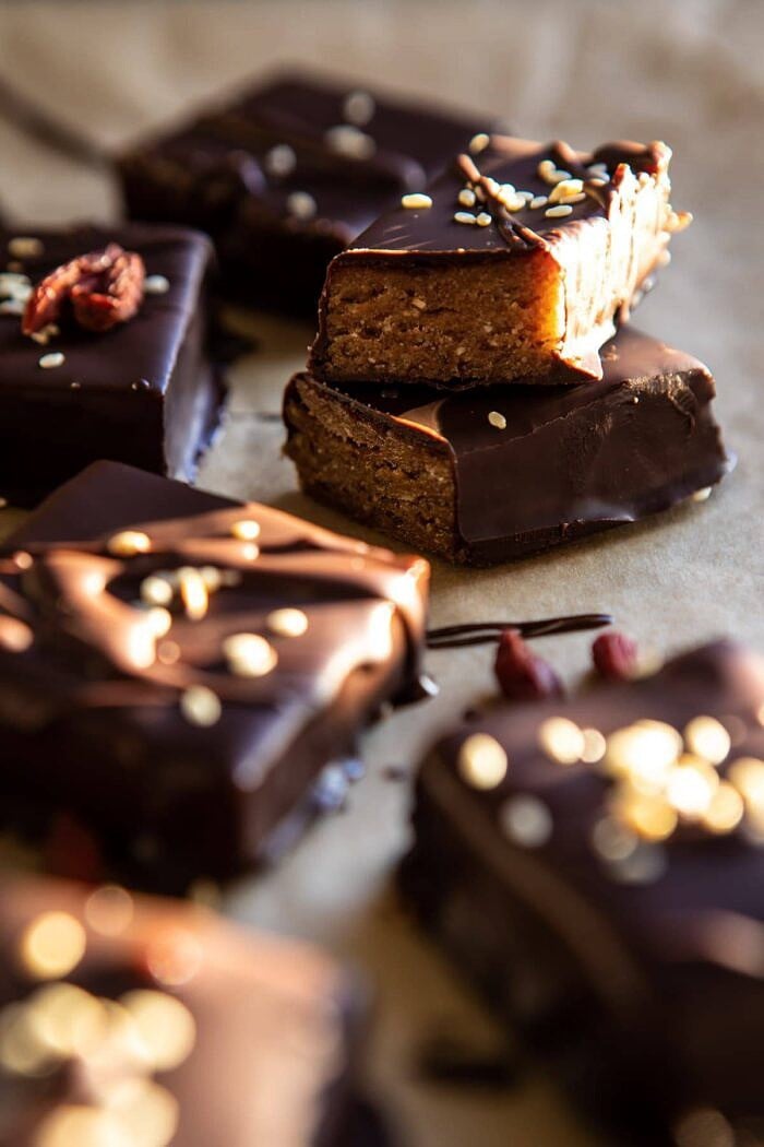 side angle photo of 5 Ingredient Chocolate Covered Cashew Bars cut in half