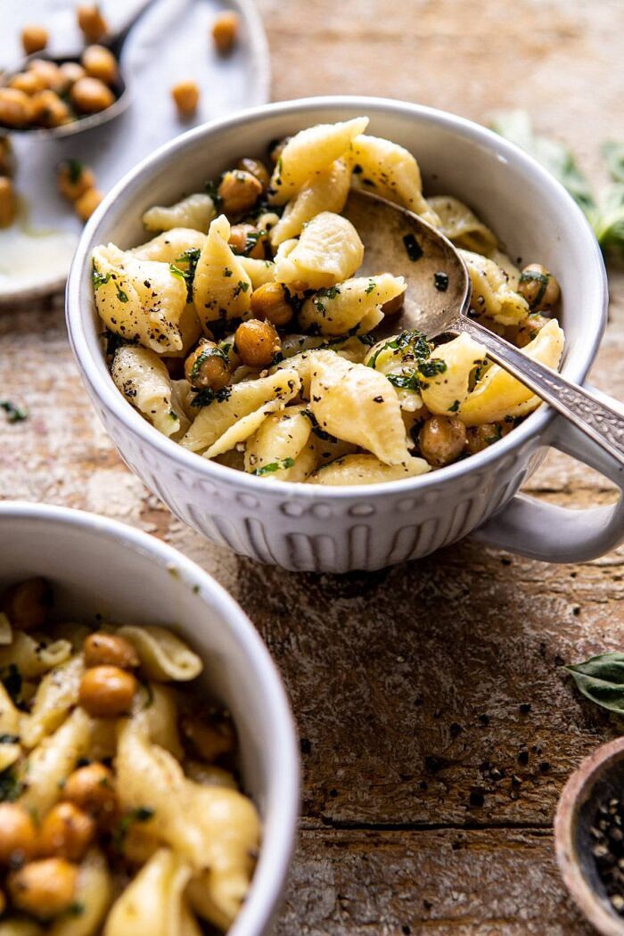 Instant Pot Cacio e Pepe with Crispy Garlic Basil Chickpeas | halfbakedharvest.com #pasta #instantpot #easyrecipes #healthyrecipes #chickpeas side angle photo of Instant Pot Cacio e Pepe with Crispy Garlic Basil Chickpeas with spoon in bowl