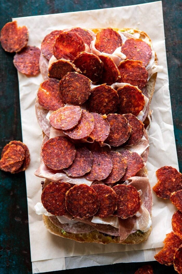 Party Size Italian Melt | halfbakedharvest.com #grilledcheese #easyrecipes #gameday pepperoni on bread before baking