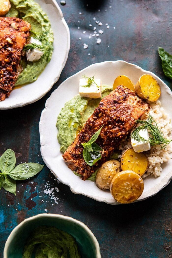 overhead close up photo of Sheet Pan Blackened Salmon Bowl with Potatoes and Avocado Goddess Sauce in bowl 