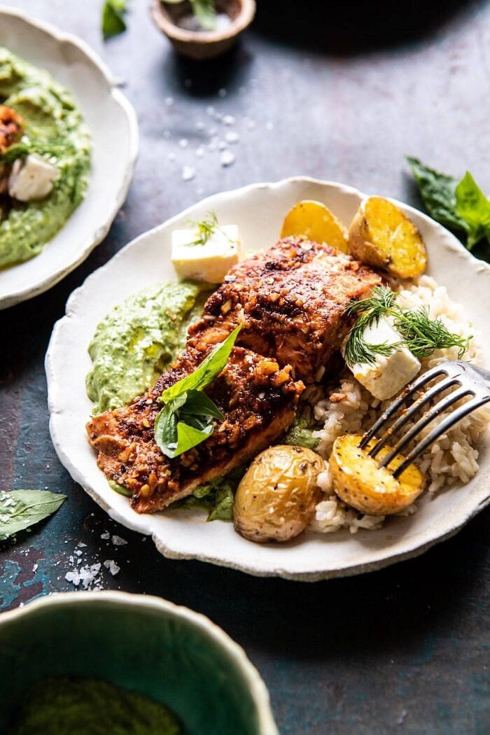 side angle photo of Sheet Pan Blackened Salmon Bowl with Potatoes and Avocado Goddess Sauce