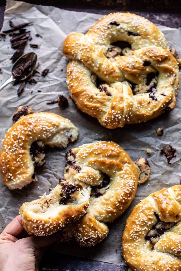 Chocolate Chip Cookie Stuffed Soft Pretzels | halfbakedharvest.com #pretzels #cookies #chocolatechipcookies #dessert #superbowl Chocolate Chip Cookie Stuffed Soft Pretzel torn apart and chocolate oozing out