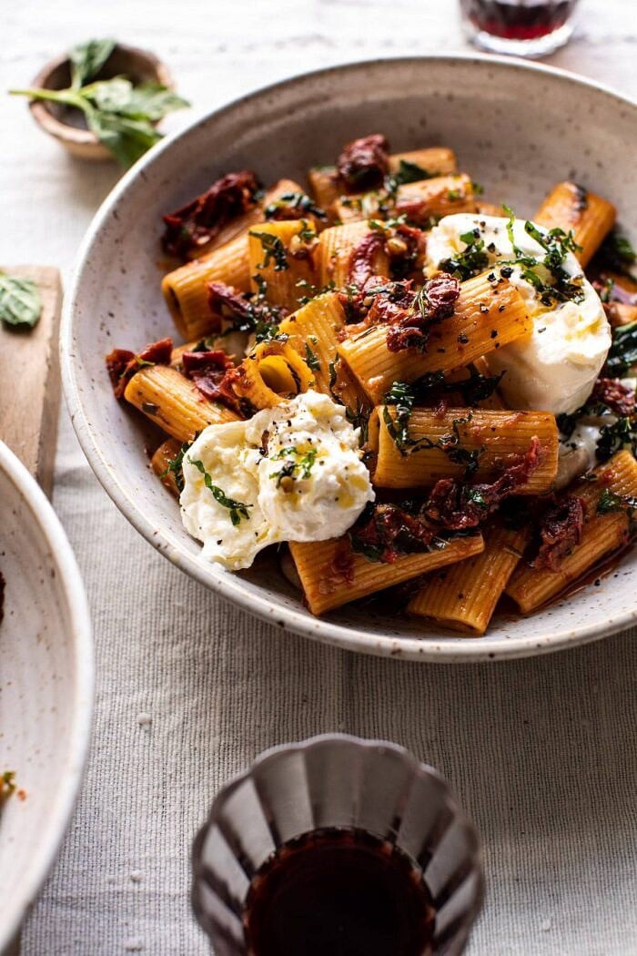 Quick Pantry Pasta with Sun-Dried Tomatoes and Burrata | halfbakedharvest.com #pasta #pantrypasta #easyrecipes #Italian #dinner side angled close up photo of Quick Pantry Pasta with Sun-Dried Tomatoes and Burrata