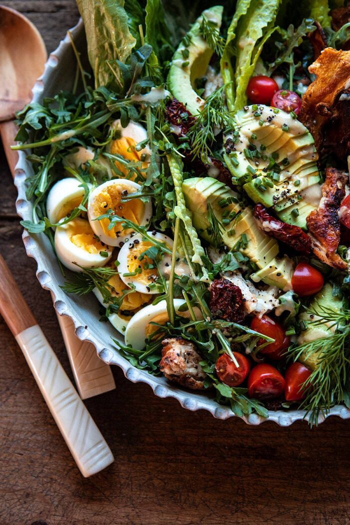 overhead close up photo of Sun-Dried Tomato Chicken and Avocado Cobb Salad with Tahini Ranch