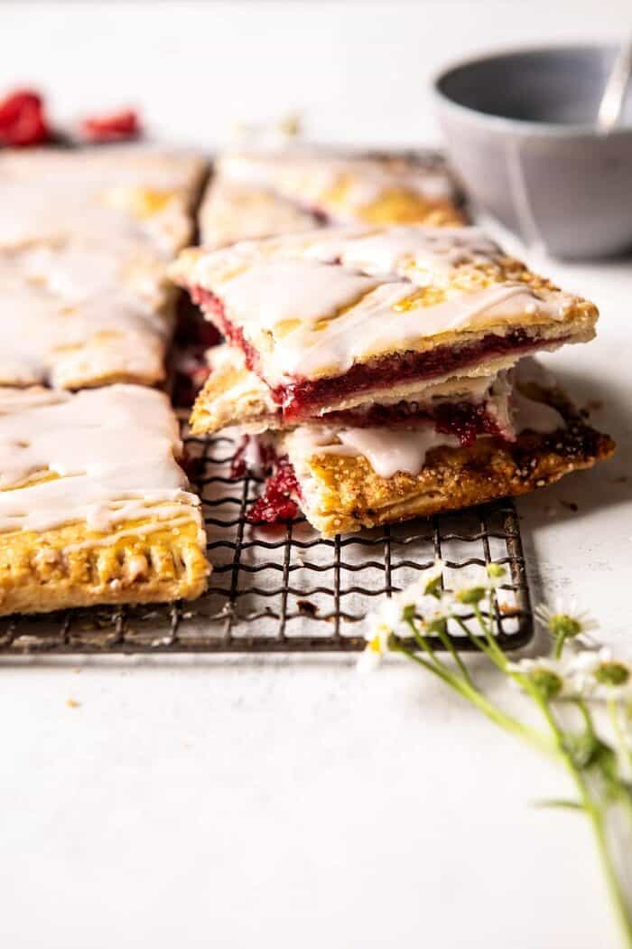 side angle of Giant Strawberries n' Cream Pop Tart cut into pieces and stacked