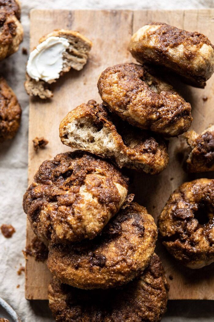 Homemade Cinnamon Crunch Bagels | halfbakedharvest.com #homemade #bagels #easyrecipes #brunch #breakfast Homemade Cinnamon Crunch Bagels with bite taken out of bagel