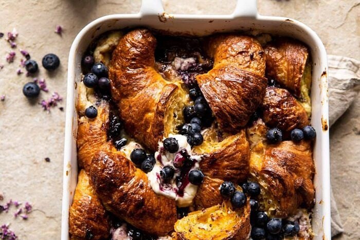 Berry and Cream Cheese Croissant French Toast Bake | halfbakedharvest.com #frenchtoast #brunch #easyrecipes #springrecipes #easter horizontal photo of Berry and Cream Cheese Croissant French Toast Bake