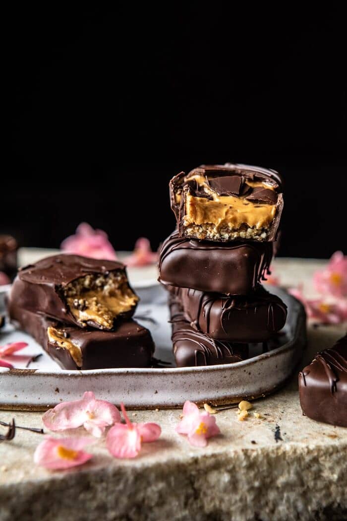 front on photo of Chocolate Covered Creamy Peanut Butter Cup Bars stacked on top of each other with 1 bar broken in half