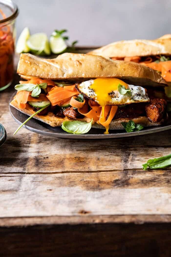 front on photo of 30 Minute Basil Chicken Banh Mi Sandwich with egg broken and yolk running