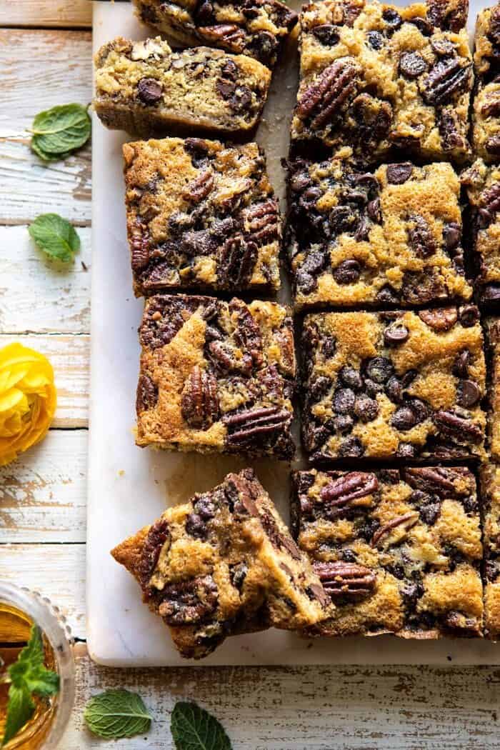 Kentucky Derby Pie Chocolate Chip Cookie Bars | halfbakedharvest.com #cookiebars #pecanpie #chocolatechip #dessert overhead close up photo Kentucky Derby Pie Chocolate Chip Cookie Bars