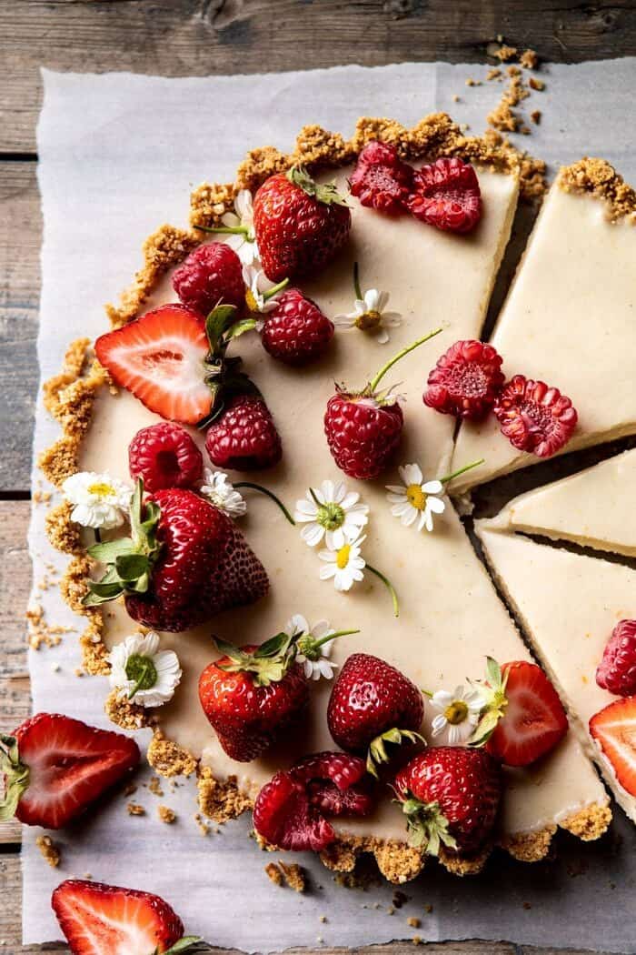 No Fuss Lemon Tart | halfbakedharvest.com #lemontart #dessert #summer #nobake #easyrecipes overhead close up photo of No Fuss Lemon Tart with 3 slices cut