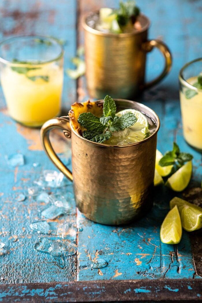 Orange Pineapple Moscow Mule | halfbakedharvest.com #cocktails #drinks #vodka side angled photo of Orange Pineapple Moscow Mule
