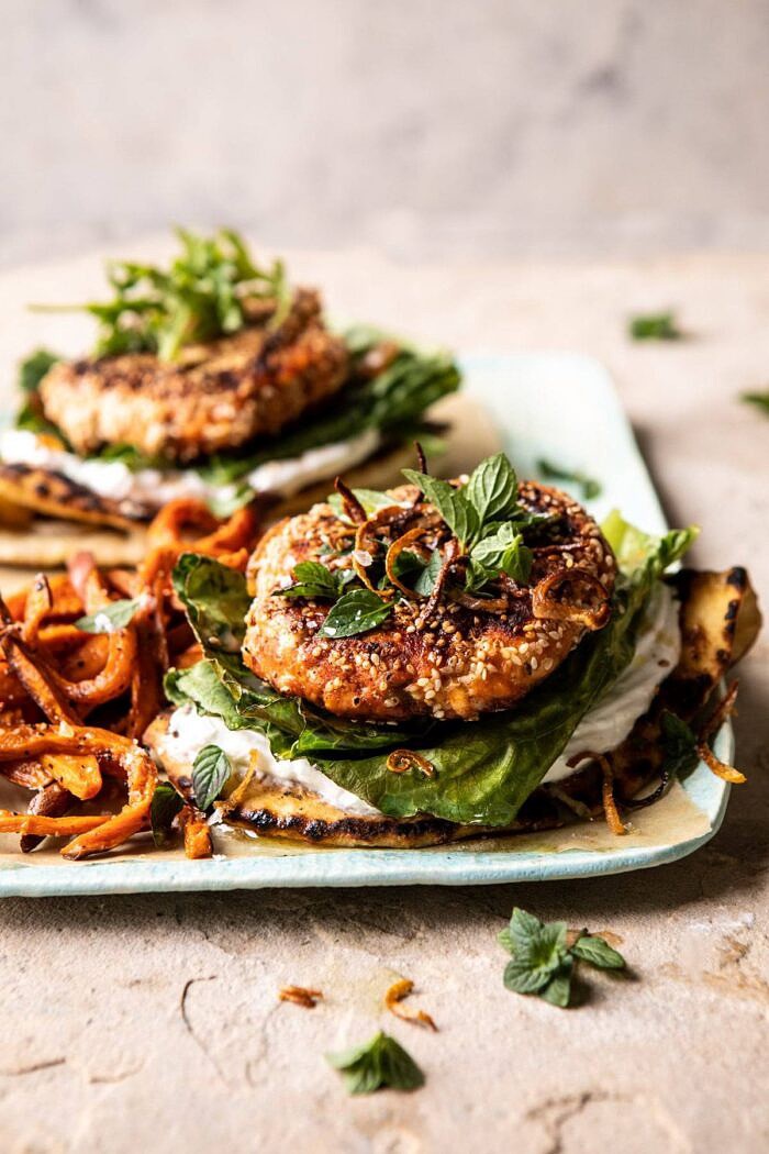 Sesame Crusted Curried Salmon Burgers with Lemony Herbs | halfbakedharvest.com #salmon #healthy #burger #summer front on photo of Sesame Crusted Curried Salmon Burgers with Lemony Herbs