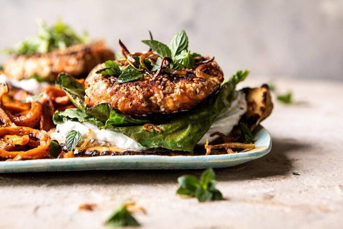 Sesame Crusted Curried Salmon Burgers with Lemony Herbs | halfbakedharvest.com #salmon #healthy #burger #summer horizontal photo of Sesame Crusted Curried Salmon Burgers with Lemony Herbs