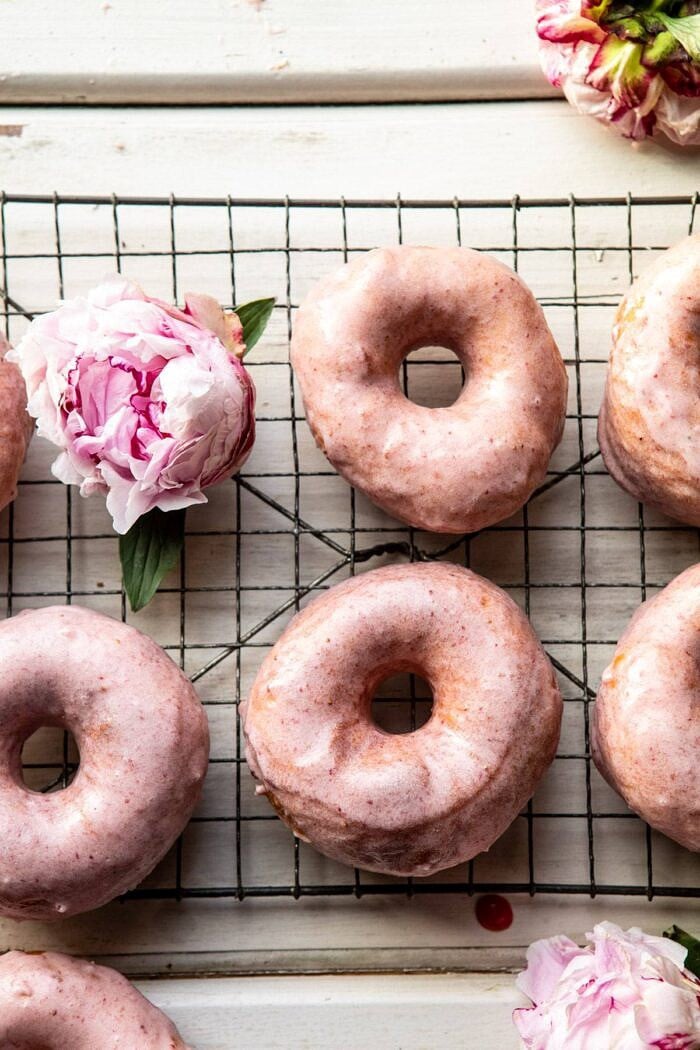 Strawberry Glazed Chai Doughnuts | halfbakedharvest.com #doughnuts #spring #strawberries overhead photo of Strawberry Glazed Chai Doughnuts