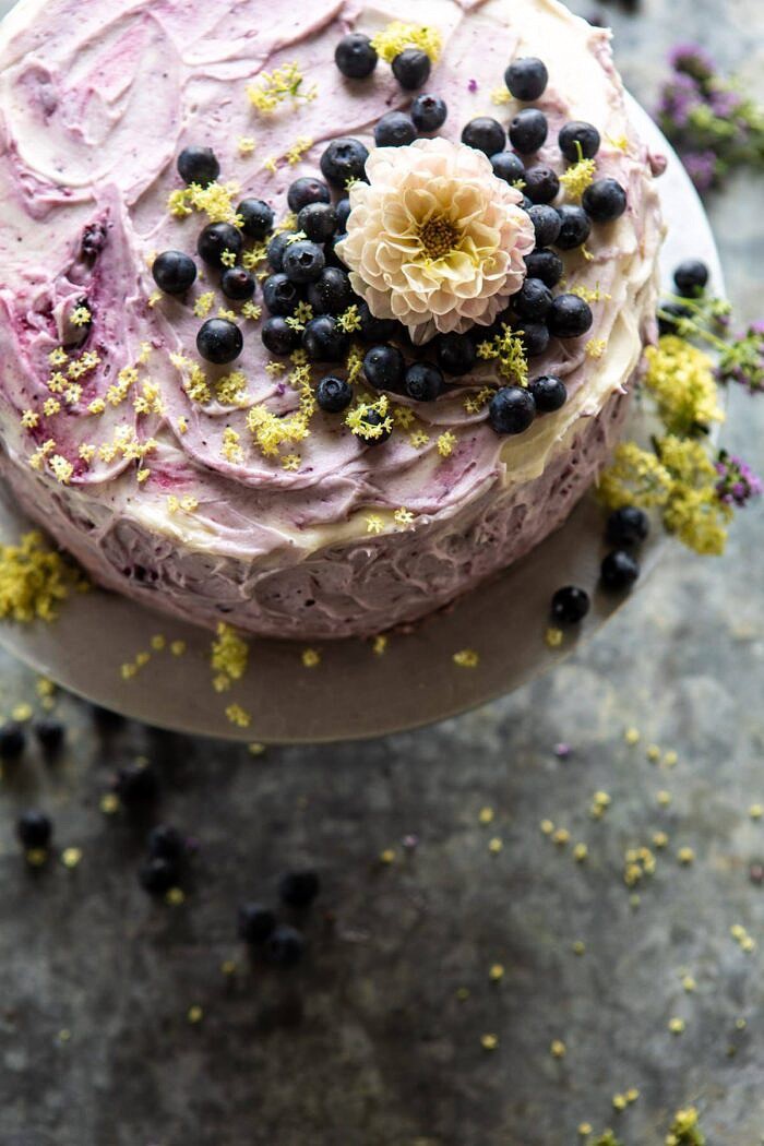 Bursting Blueberry Lemon Layer Cake | halfbakedharvest.com #bleberrycake #layercake #summerrecipes #dessert overhead close up photo of Bursting Blueberry Lemon Layer Cake