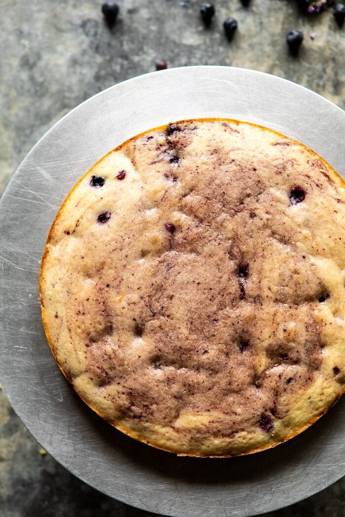 Bursting Blueberry Lemon Layer Cake | halfbakedharvest.com #bleberrycake #layercake #summerrecipes #dessert first cake layer