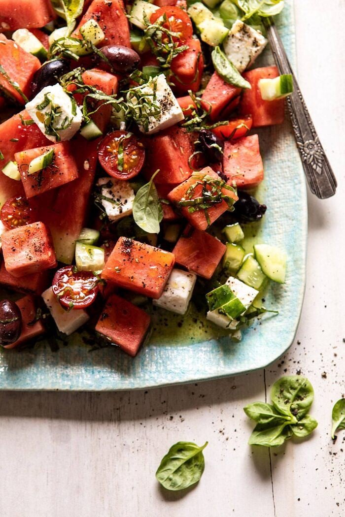 Greek Watermelon Feta Salad with Basil Vinaigrette | halfbakedharvest.com #watermelon #summerrecipes #easyrecipes #healthy overhead close up photo of Greek Watermelon Feta Salad with Basil Vinaigrette