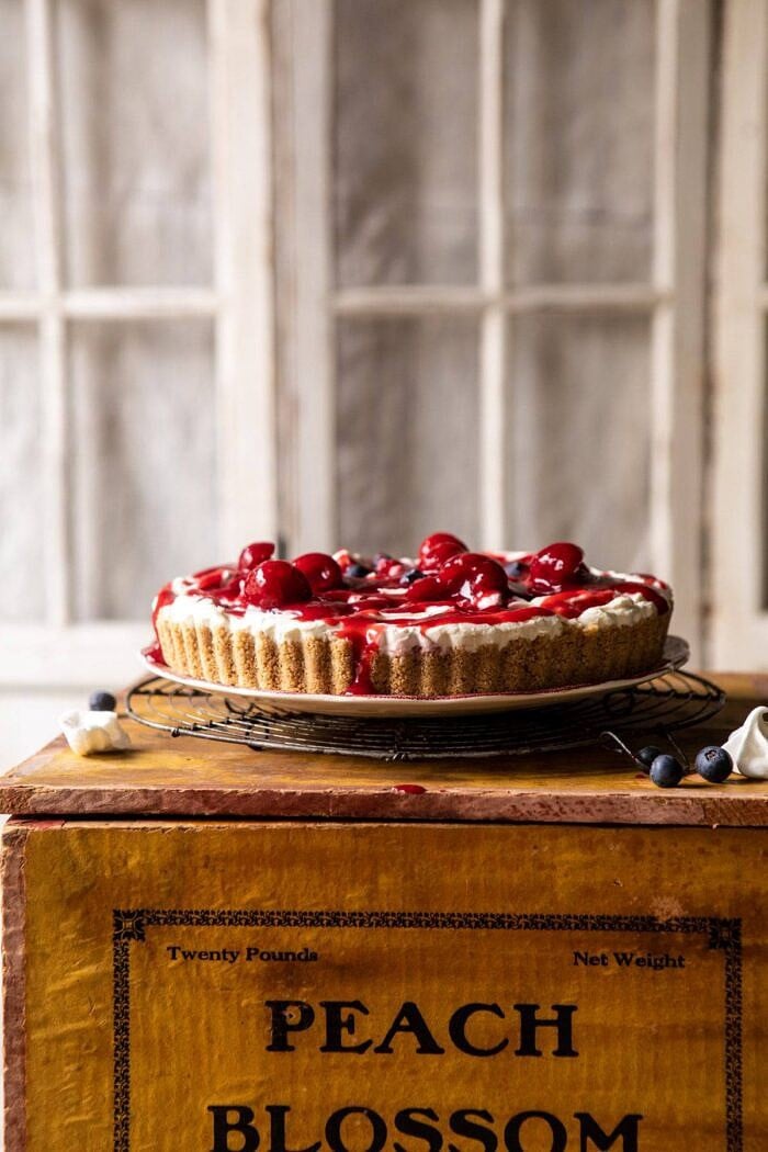 No-Bake Eton Mess Berry Cheesecake | halfbakedharvest.com #cheesecake #nonbake #easyrecipes #dessert #4thofjuly front on photo of No-Bake Eton Mess Berry Cheesecake before adding whipped cream