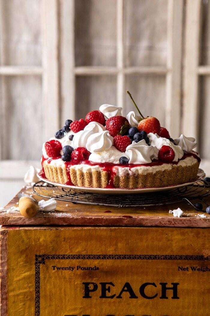 No-Bake Eton Mess Berry Cheesecake | halfbakedharvest.com #cheesecake #nonbake #easyrecipes #dessert #4thofjuly head on photo of No-Bake Eton Mess Berry Cheesecake