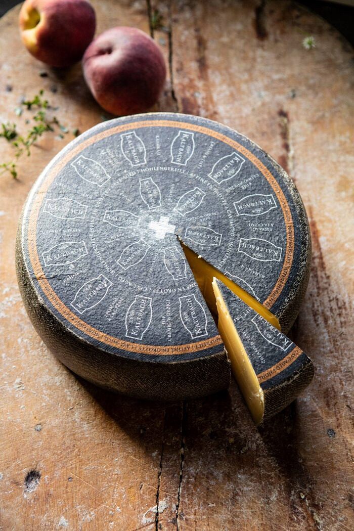 Peach Thyme Tarts | halfbakedharvest.com #peach #cheese #summer #appetizer cheese wheel n cutting board