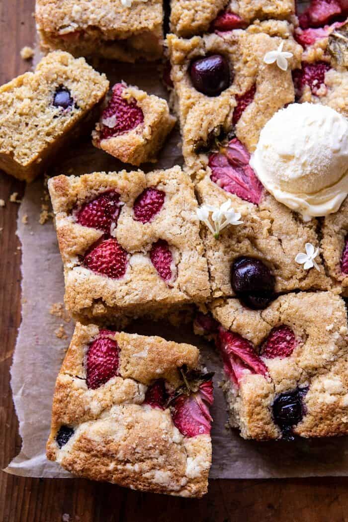 overhead close up photo of Cherry Strawberry Streusel Cake with ice cream on cake 