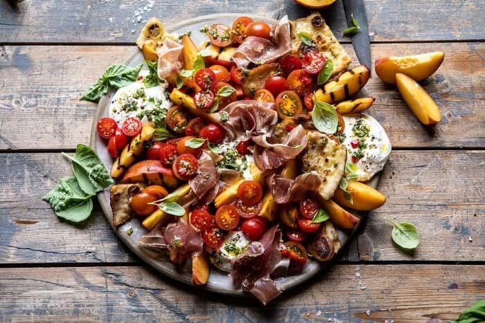 horizontal photo of Peach Caprese Salad with Toasted Garlic Naan 