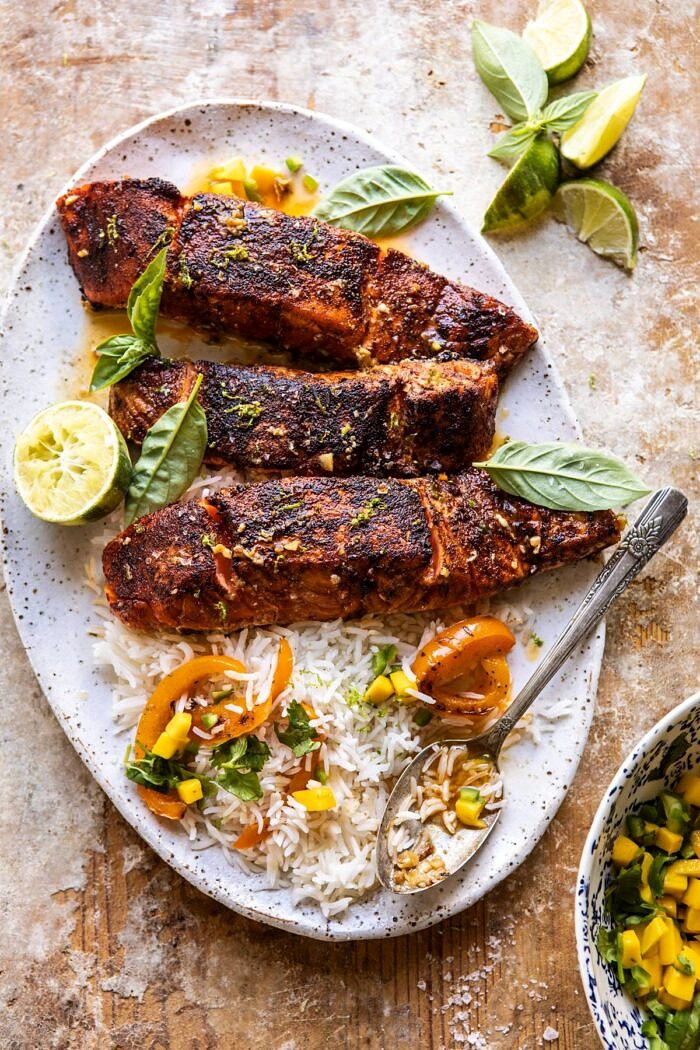 Cilantro Lime Salmon with Mango Salsa | halfbakedharvest.com #salmon #easyrecipes #healthyrecipes #dinner overhead photo of Cilantro Lime Salmon with Mango Salsa with rice on platter