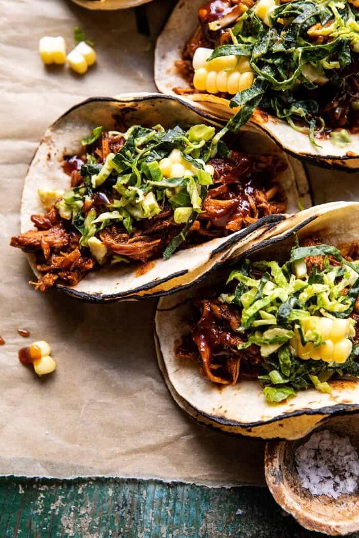 side angled, close up photo of Instant Pot BBQ Beer Pulled Chicken Tacos with Ranch Corn Slaw 