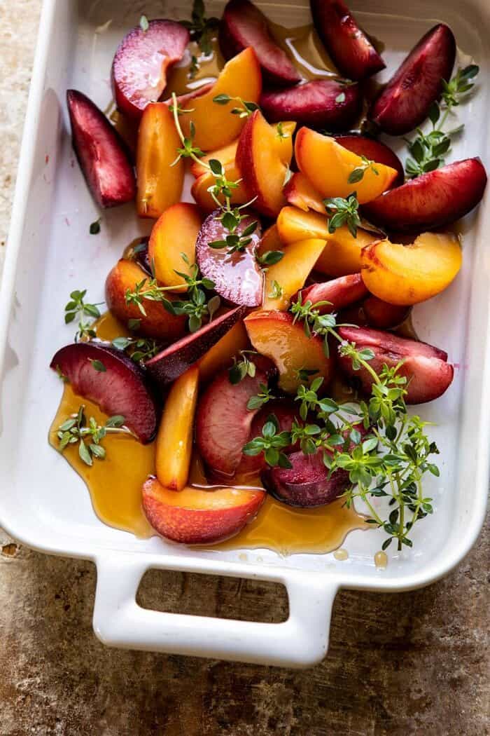 plums in roasting pan before roasting 