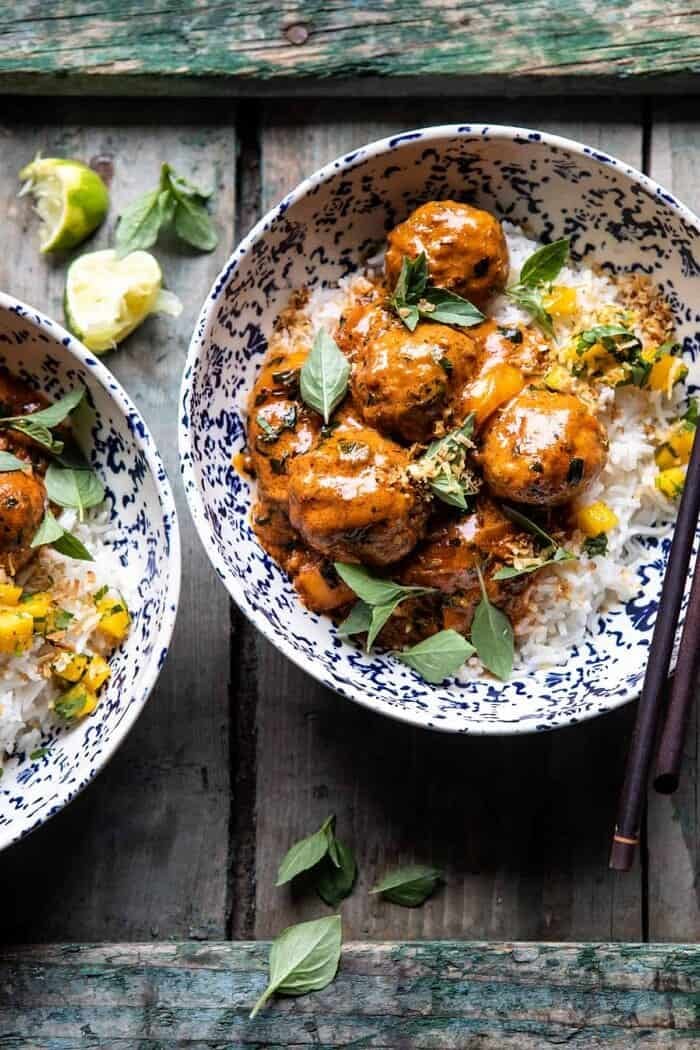 overhead close up photo of Weeknight 30 Minute Coconut Curry Chicken Meatballs in bowls with rice