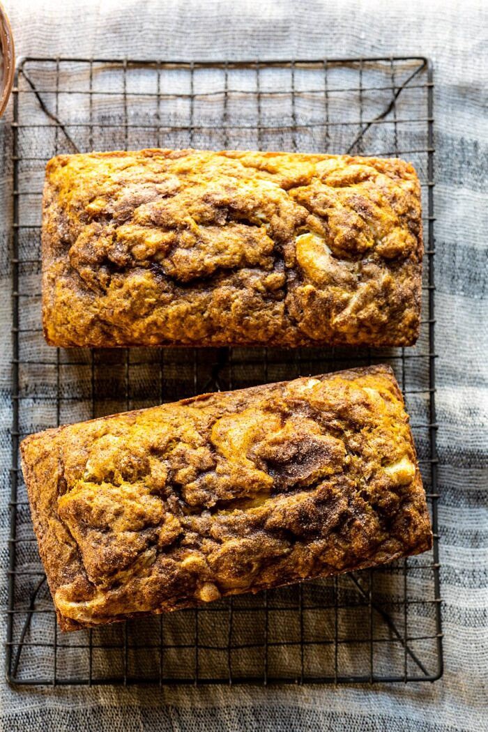 overhead photo of Cream Cheese Swirled Pumpkin Bread on cooling rack after baking 