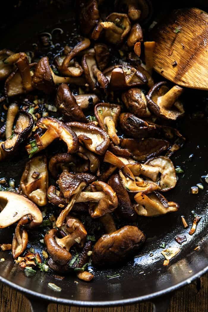 Herby Buttered Mushroom Stroganoff | halfbakedharvest.com #easyrecipes #familydinner #autumn #cozyrecipes #fallrecipes overhead photo of Herby Buttered Mushrooms in skillet