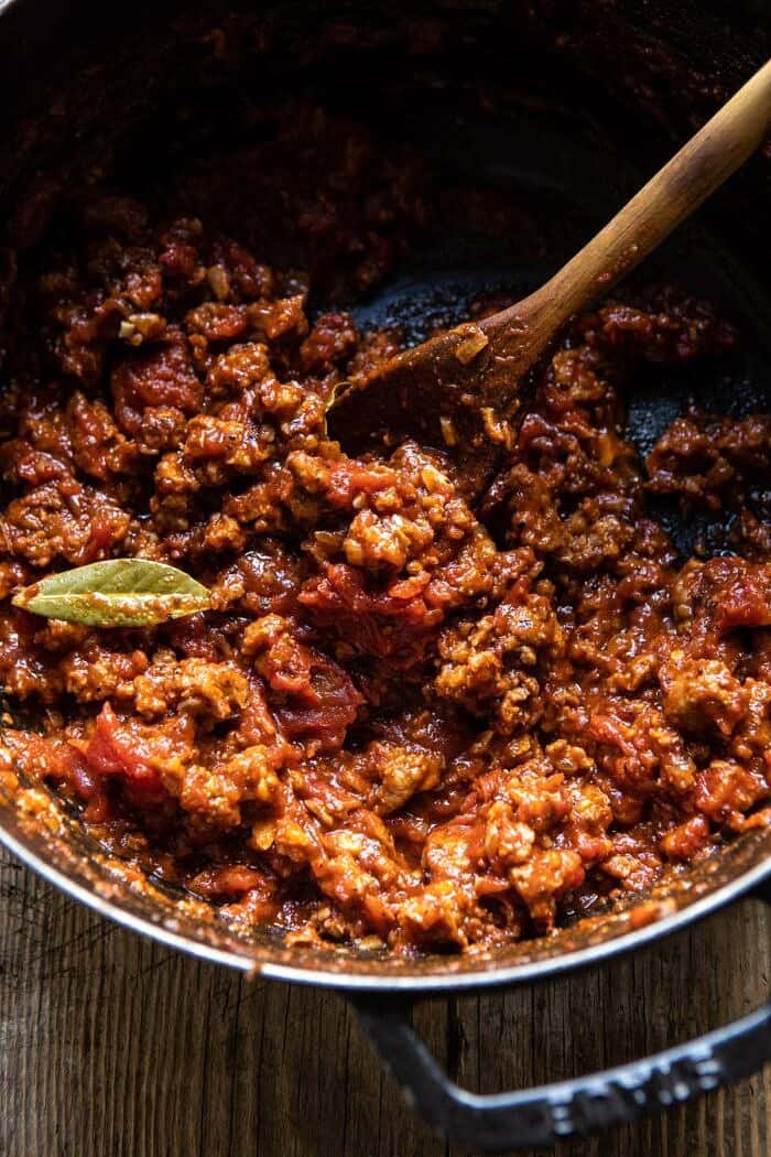 Roasted Garlic Spaghetti Squash Lasagna Boats | halfbakedharvest.com #healthyrecipes #spaghettisquash #fall #easyrecipes overhead photo of ragu sauce in pot